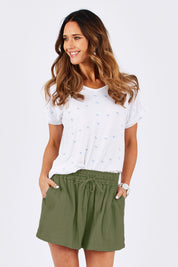 Model Clementine wearing size 10 of The Bonded Cotton Short in colour Khaki (Green), from the front, cropped image