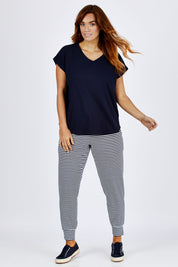 Model Laura wearing size 12 of The Essential Layering Tee in colour Navy (Blue), from the front, showing the whole outfit