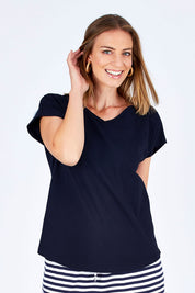 Model Riina wearing size 10 of The Essential Layering Tee in colour Navy (Blue), from the front, cropped image