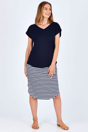 Model Riina wearing size 10 of The Essential Layering Tee in colour Navy (Blue), from the front, showing the whole outfit