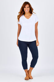 Model Laura wearing size 12 of The Essential Layering Tee in colour White (White), from the front, showing the whole outfit