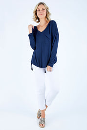 Model Chelsea wearing size 10 of The Luxe Long Sleeve Tee in colour Navy (Blue), from the front, showing the whole outfit