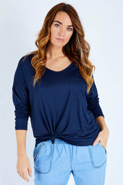 Model Laura wearing size 14 of The Luxe Long Sleeve Tee in colour Navy (Blue), from the front, cropped image