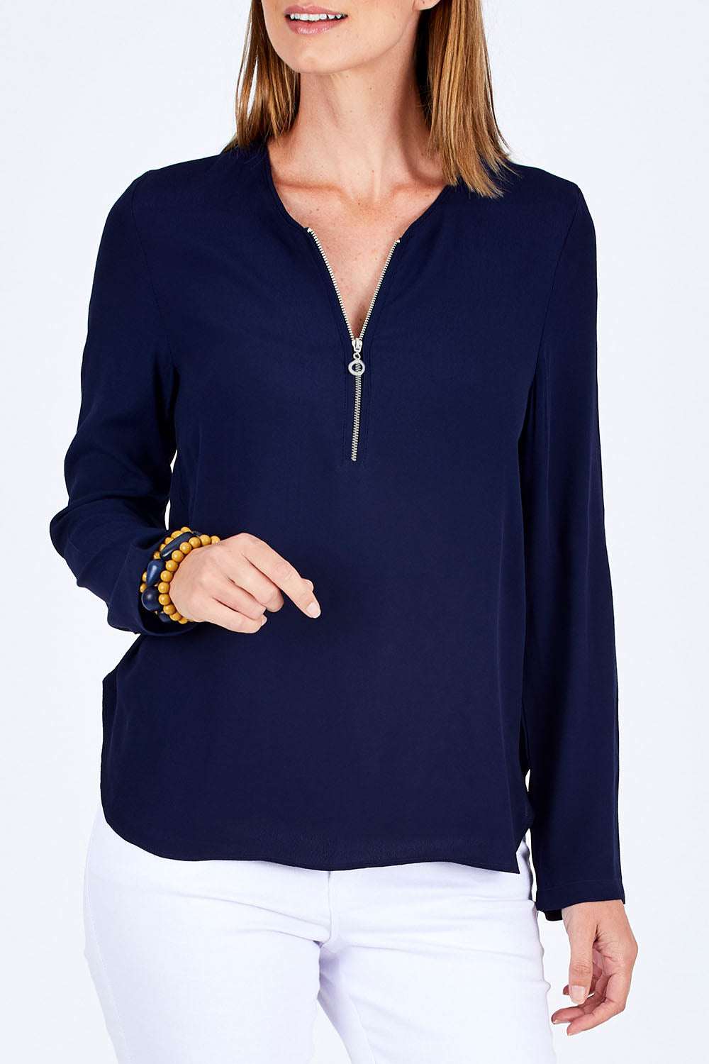 Model Riina wearing size 10 of The Zip Front Blouse in colour Navy (Blue), from the front, cropped image