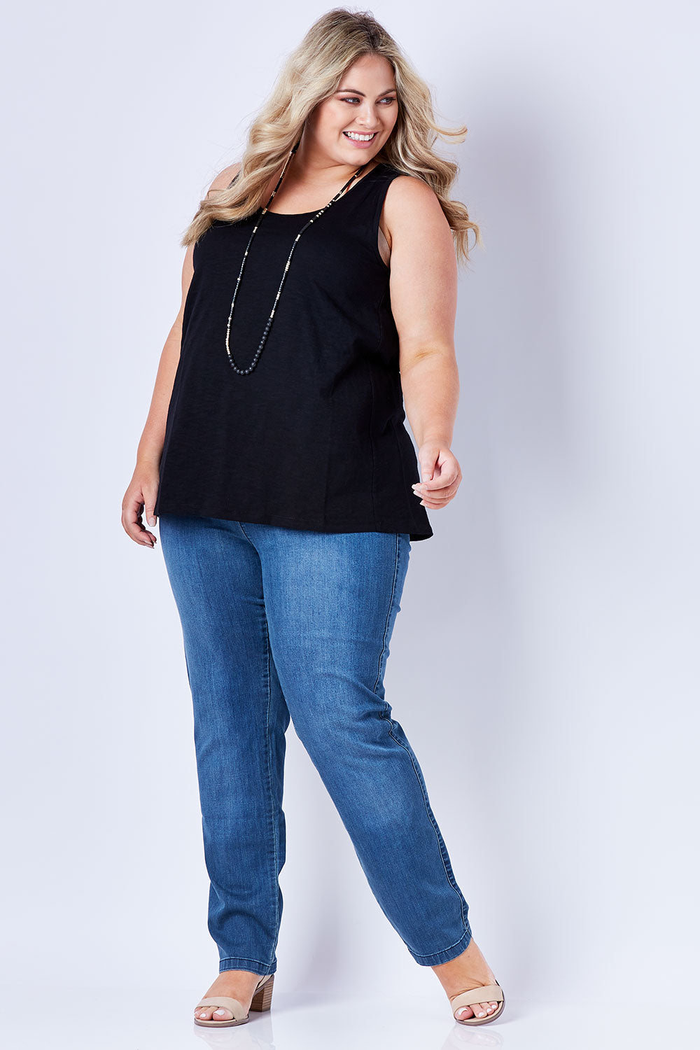 Model Sophie wearing size 18 of The Pintuck Back Tank in colour Black (Black), from the front, showing the whole outfit