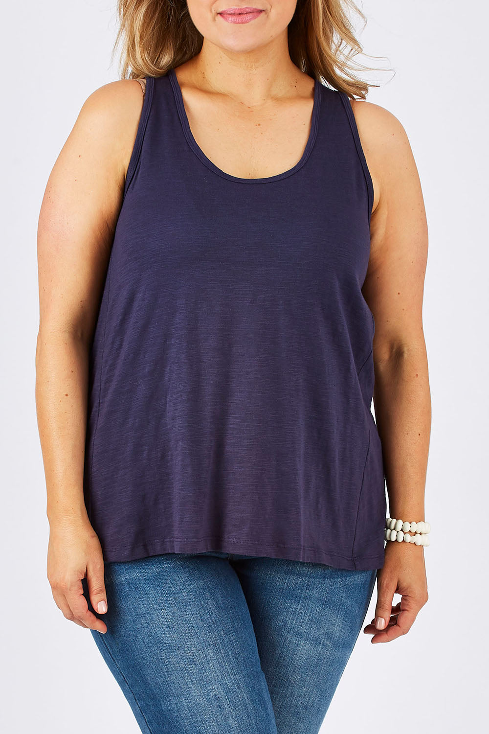 Model Ljubenka wearing size 18 of The Pintuck Back Tank in colour InsigBlue (Blue), from the front, cropped image