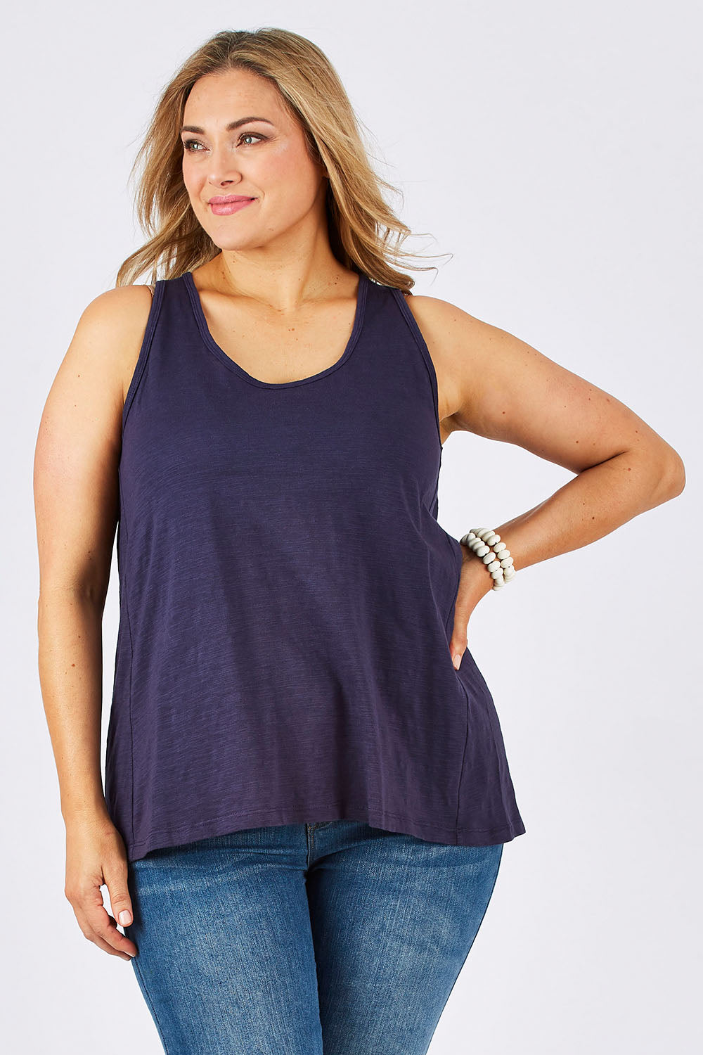 Model Ljubenka wearing size 18 of The Pintuck Back Tank in colour InsigBlue (Blue), from the front, cropped image