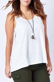Model Laura wearing size 12 of The Pintuck Back Tank in colour OffWhite (White), from the front, cropped image