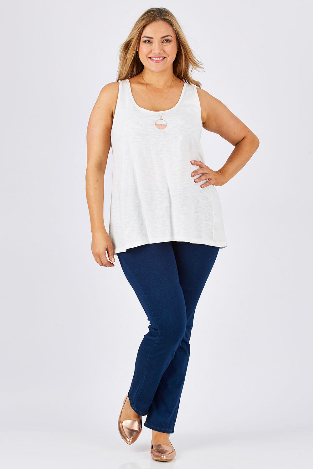 Model Ljubenka wearing size 18 of The Pintuck Back Tank in colour OffWhite (White), from the front, showing the whole outfit