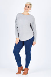 Model Stefania wearing size L of The Daily Essential Jumper in colour Grey (Grey), from the front, showing the whole outfit