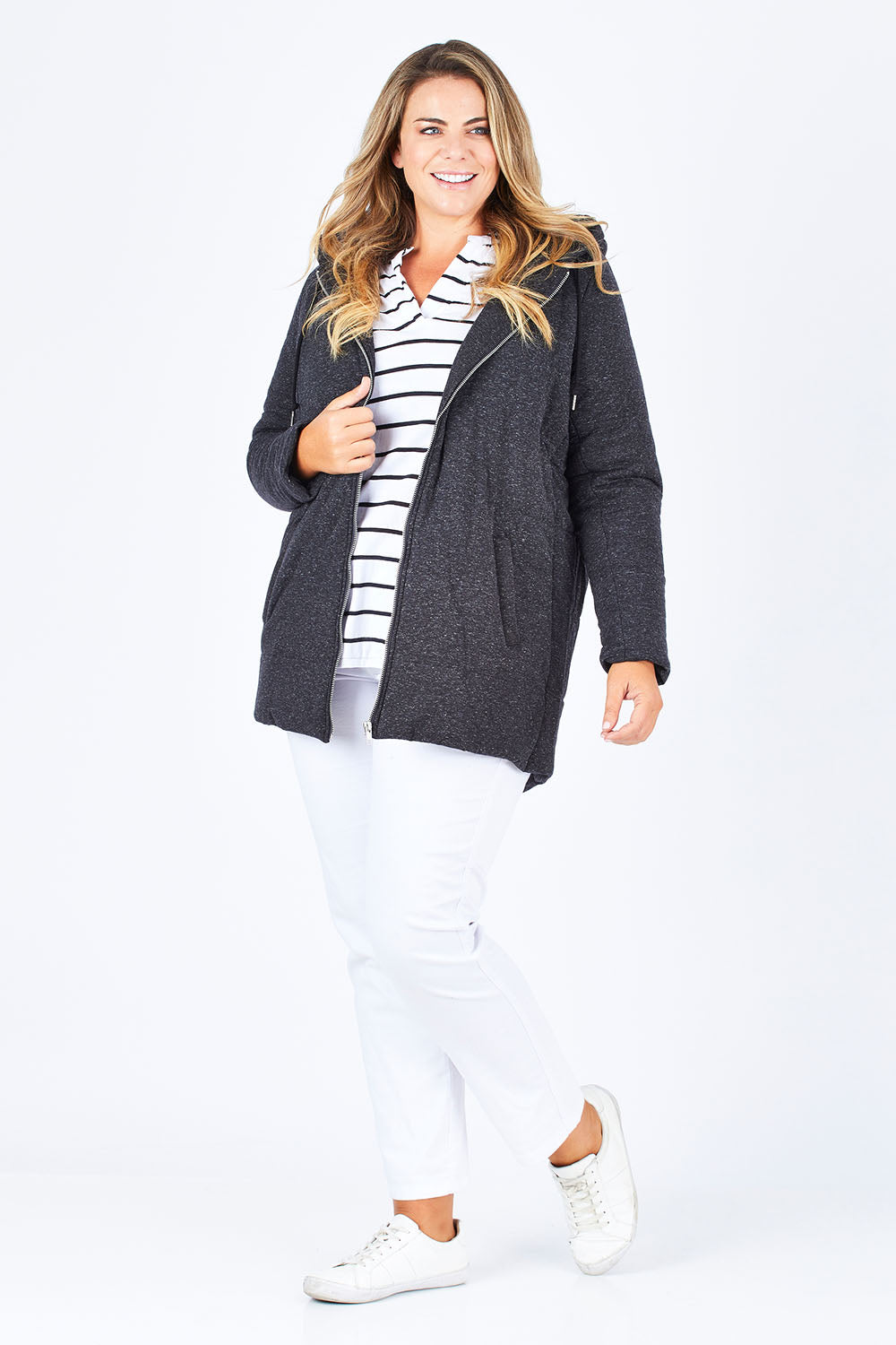 Model Fiona wearing size 16 of The Luxe Puffer Jacket in colour Charcoal (Black), from the front, showing the whole outfit