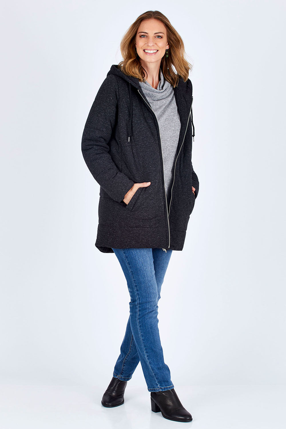 Model Riina wearing size 10 of The Luxe Puffer Jacket in colour Charcoal (Black), from the front, showing the whole outfit