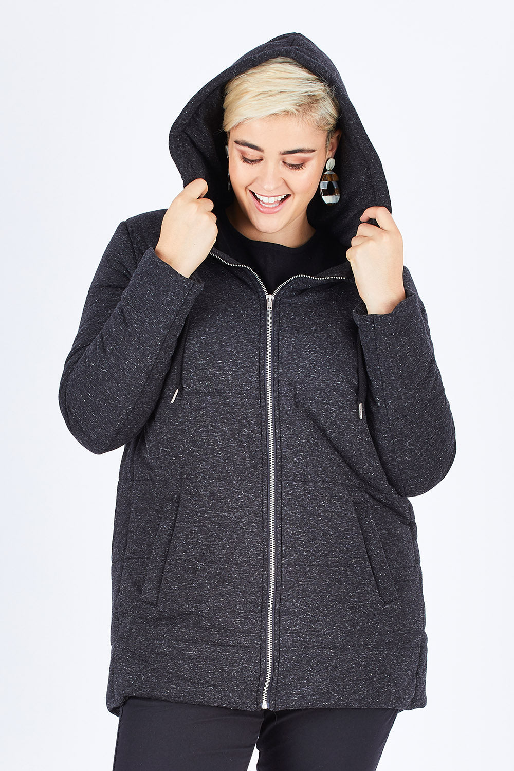Model Stefania wearing size 14 of The Luxe Puffer Jacket in colour Charcoal (Black), from the front, cropped image