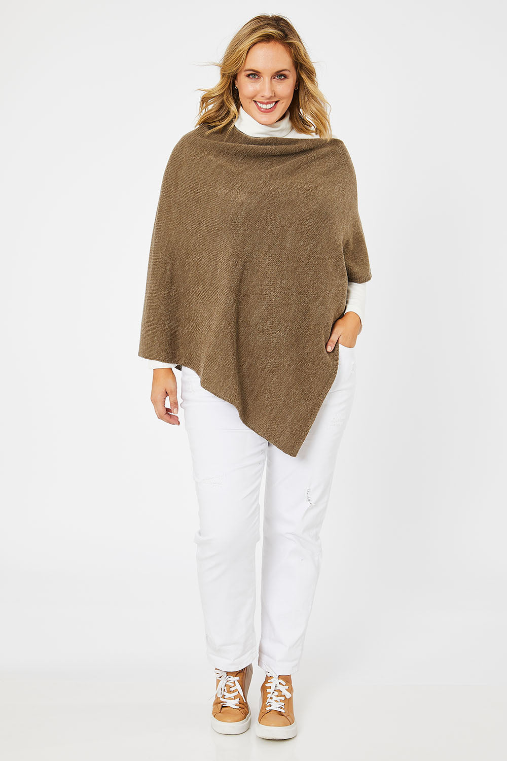 Model Jess wearing size L of The Perfect Poncho in colour Natural, from the front, showing the whole outfit