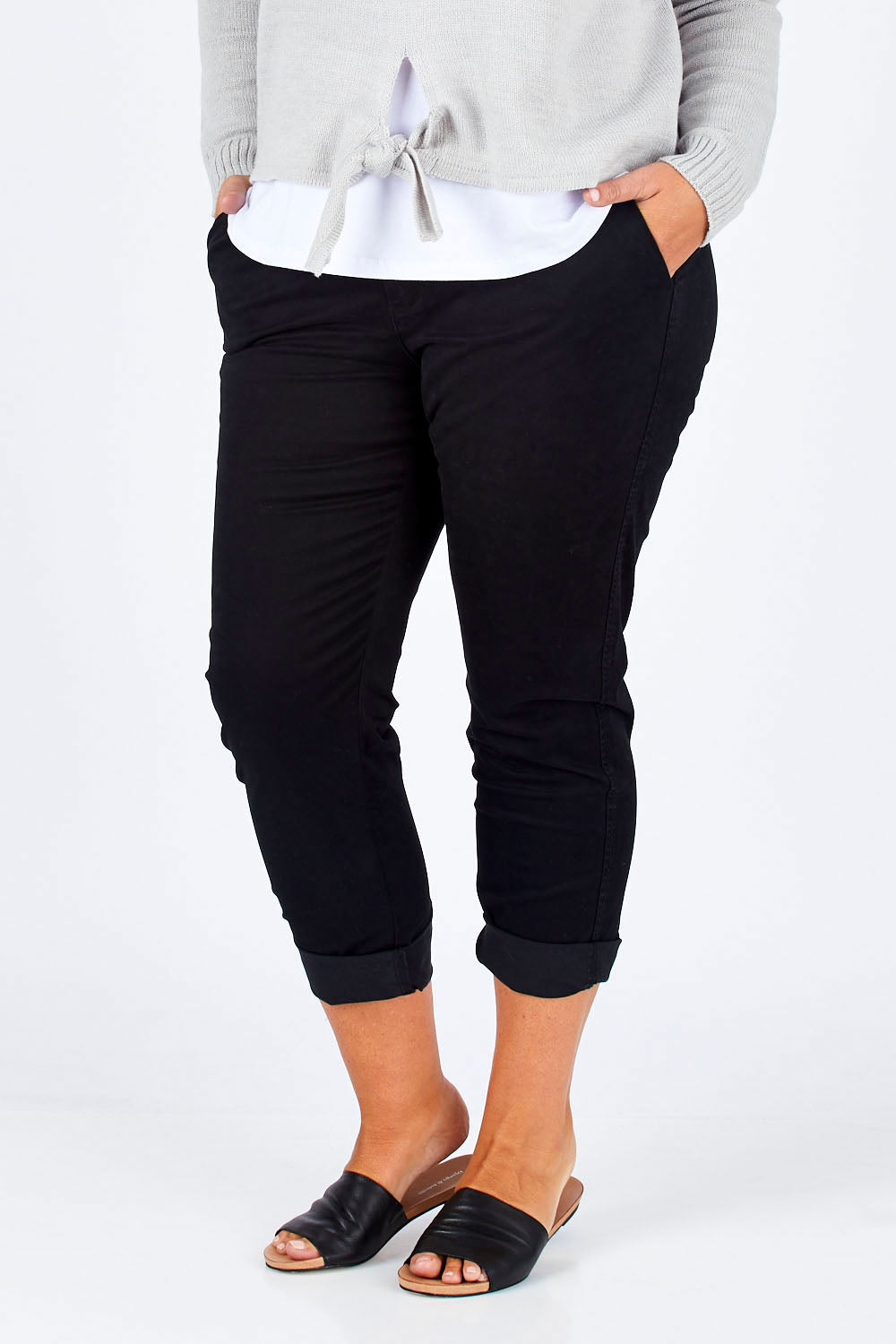 Model Fiona wearing size 16 of The Essential Chino in colour Black (Black), from the front, cropped image