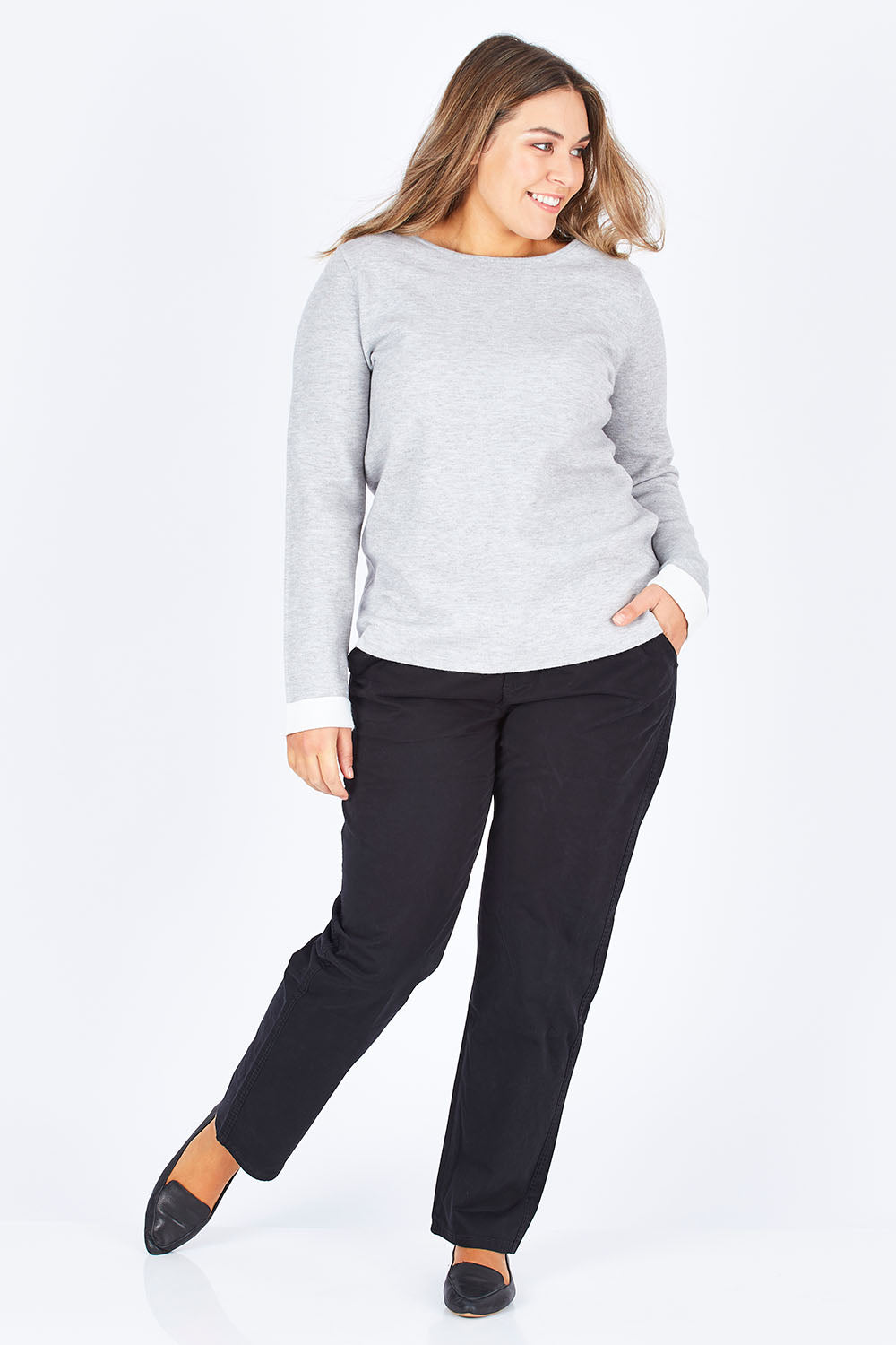 Model Natalia wearing size 14 of The Essential Chino in colour Black (Black), from the front, showing the whole outfit