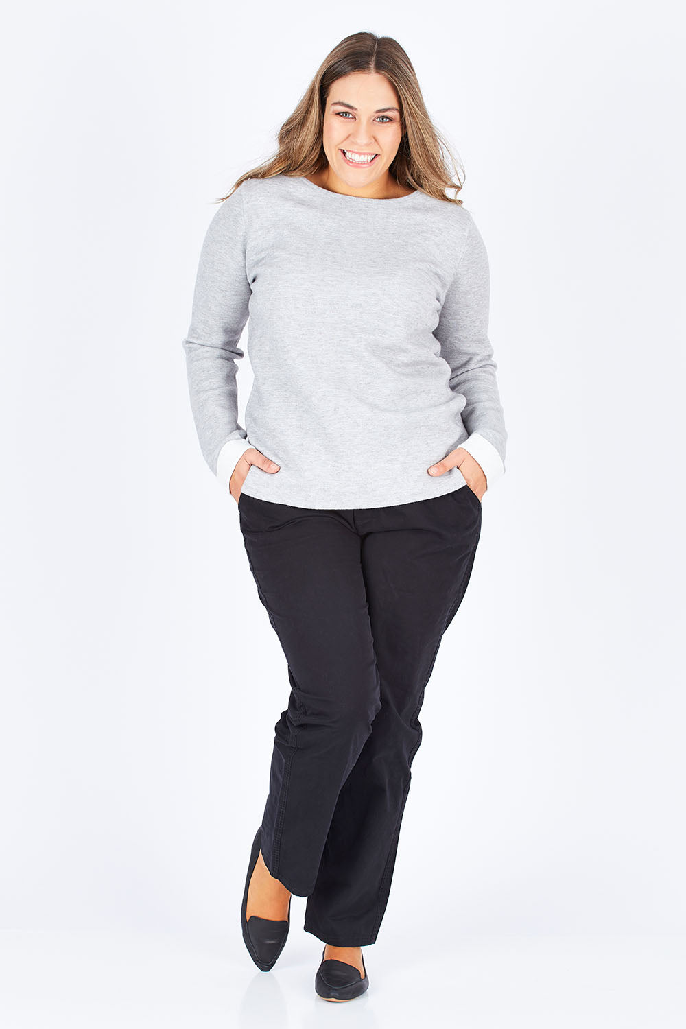 Model Natalia wearing size 14 of The Essential Chino in colour Black (Black), from the front, showing the whole outfit