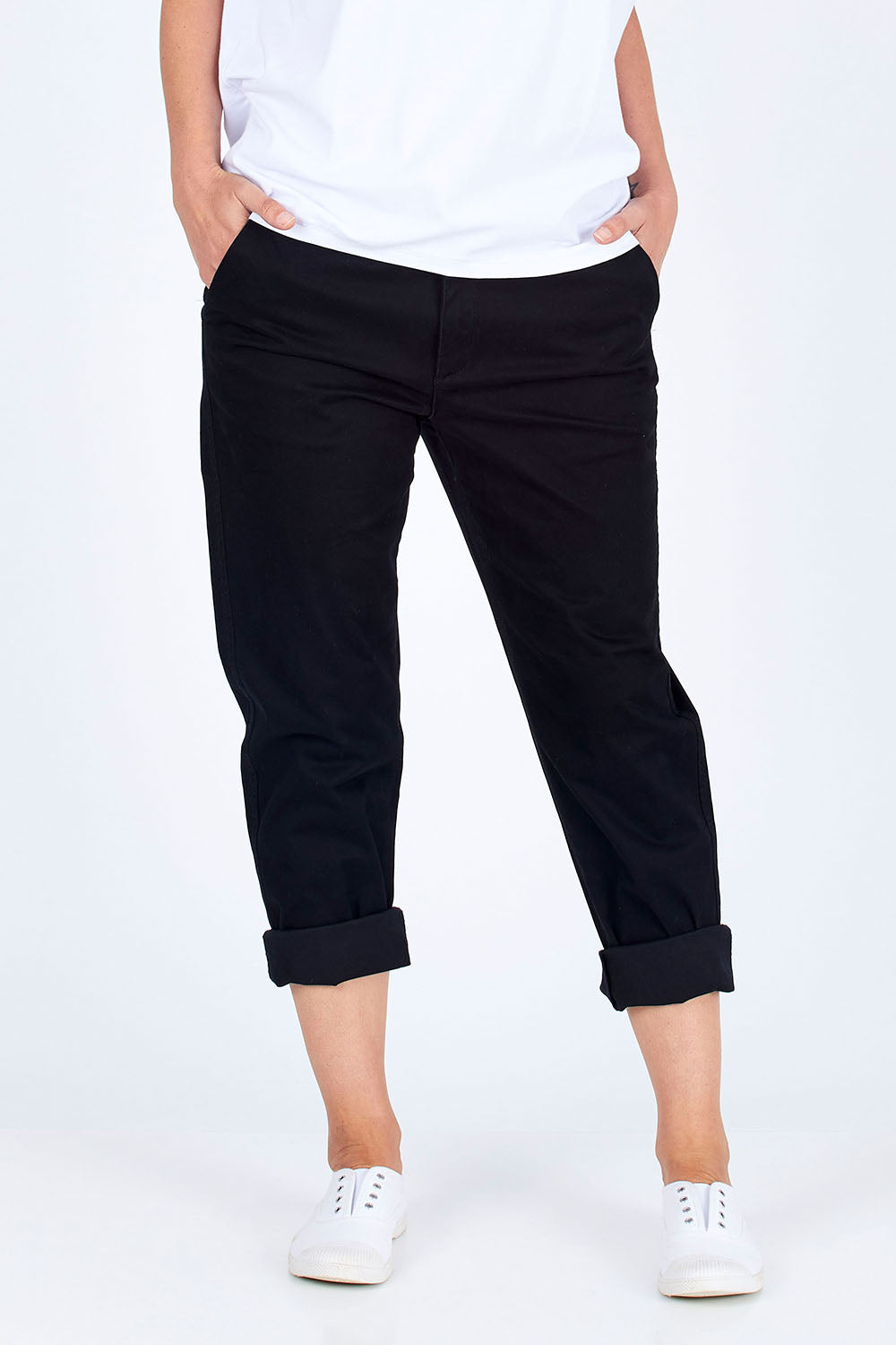 Model Riina wearing size 10 of The Essential Chino in colour Black (Black), from the front, cropped image