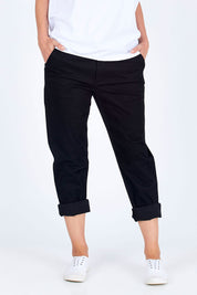 Model Riina wearing size 10 of The Essential Chino in colour Black (Black), from the front, cropped image