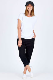 Model Riina wearing size 10 of The Essential Chino in colour Black (Black), from the front, showing the whole outfit