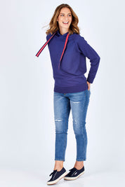 Model Riina wearing size 10 of The Tie Detail Hoody in colour FrenchBlue (Blue), from the front, showing the whole outfit