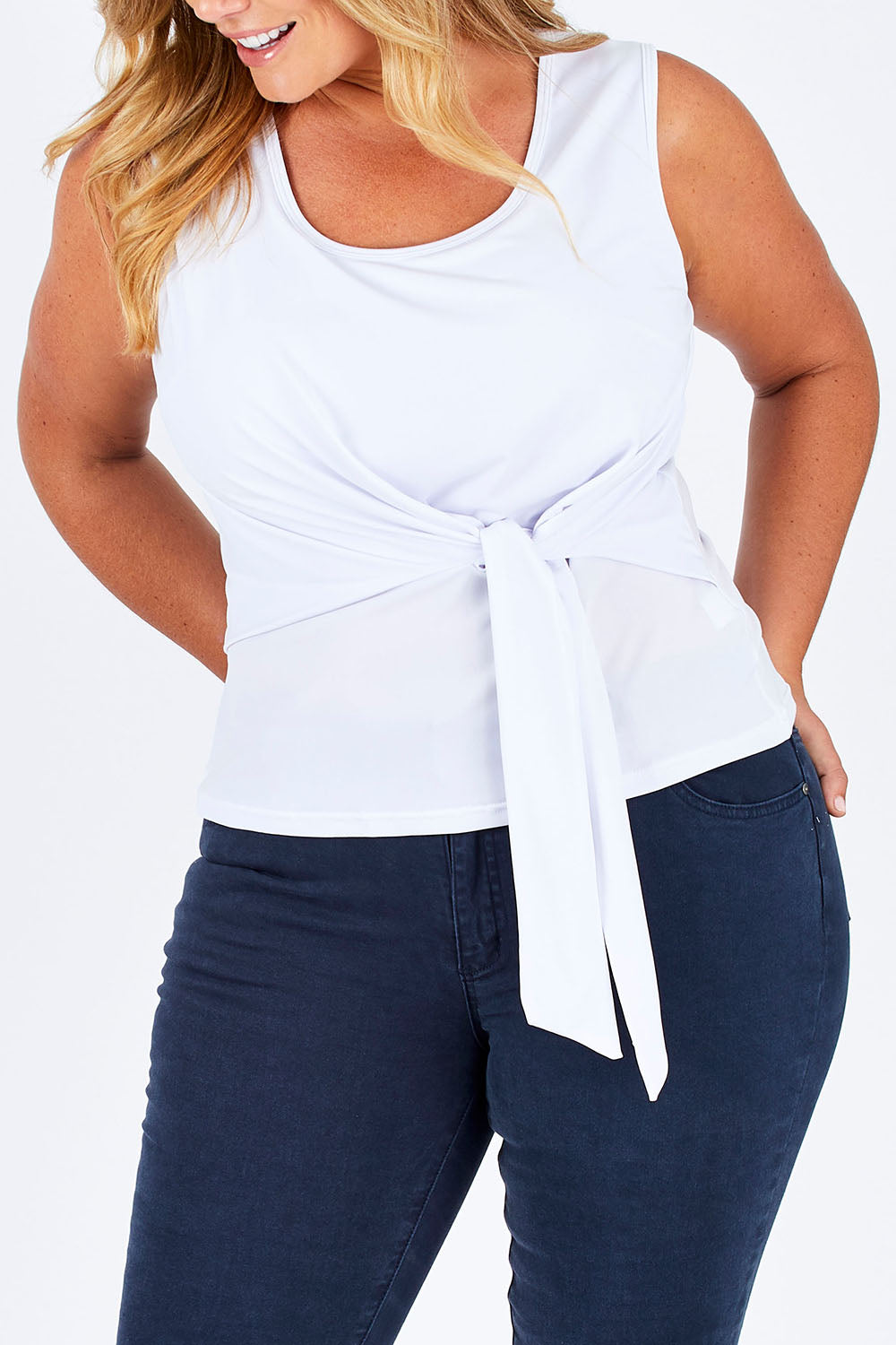 Model Fiona wearing size 16 of The Tie Front Tank in colour White (White), from the front, cropped image
