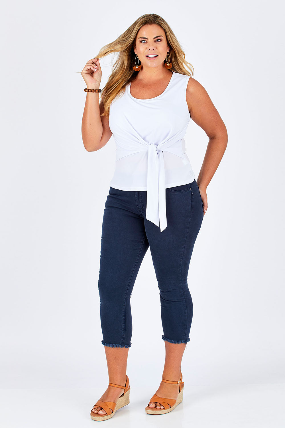 Model Fiona wearing size 16 of The Tie Front Tank in colour White (White), from the front, showing the whole outfit