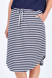 Model Riina wearing size 10 of The Weekender Comfort Skirt in colour Stripe (Black), from the front, cropped image