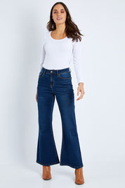 Model Elhana wearing size 10 of The Bootcut Jean in colour Drkdenim (Blue), from the front, showing the whole outfit