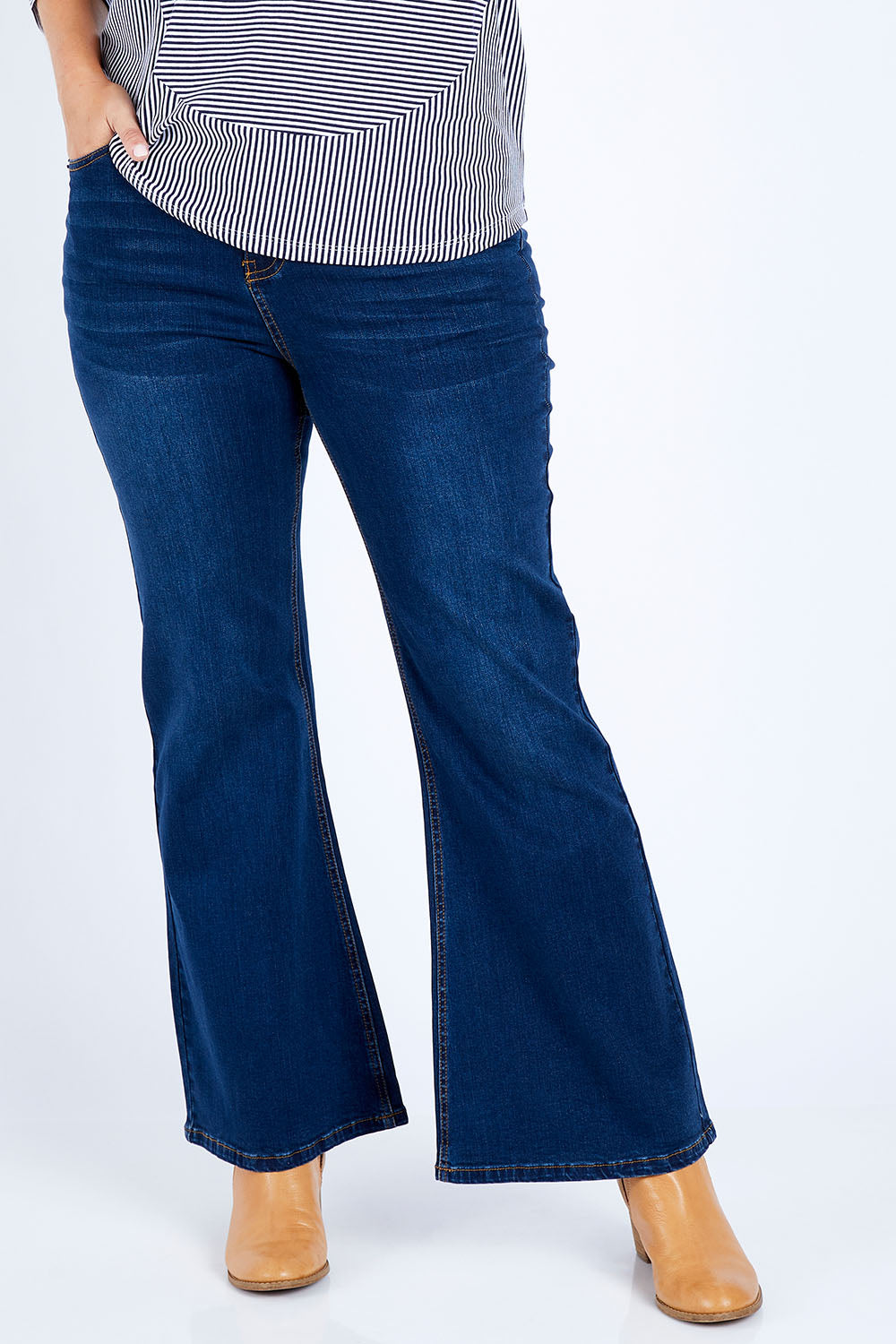Model Jess wearing size 14 of The Bootcut Jean in colour Drkdenim (Blue), from the front, cropped image