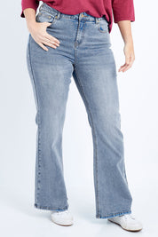 Model Laura wearing size 14 of The Bootcut Jean in colour Lightdenim (Blue), from the front, cropped image