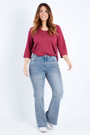Model Laura wearing size 14 of The Bootcut Jean in colour Lightdenim (Blue), from the front, showing the whole outfit