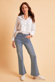 Model Madeline wearing size 10 of The Bootcut Jean in colour Lightdenim (Blue), from the front, showing the whole outfit