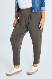 Model Palatina wearing size 16 of The Comfort Pant in colour Khaki (Green), from the front, cropped image