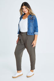 Model Palatina wearing size 16 of The Comfort Pant in colour Khaki (Green), from the front, showing the whole outfit