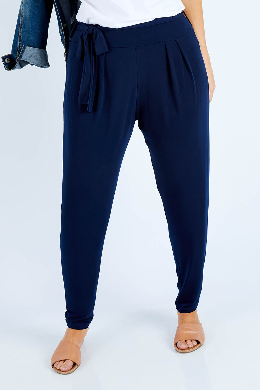 Model Laura wearing size 14 of The Comfort Pant in colour Navy (Blue), from the front, cropped image