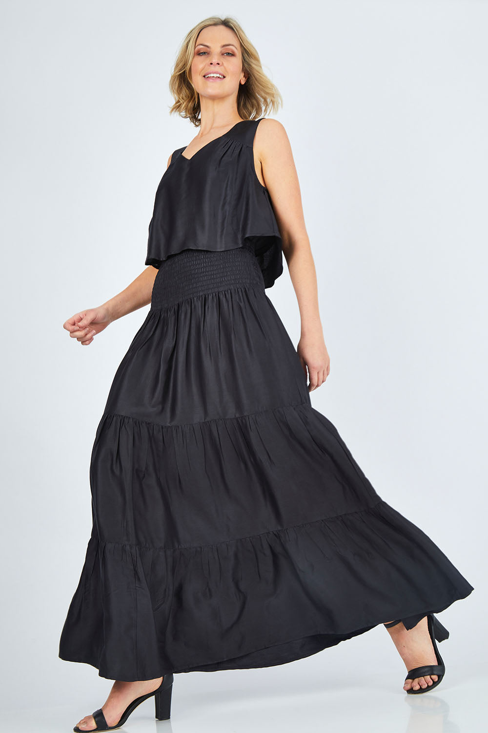 Model Chelsea wearing size 10 of The Overlay Maxi Dress in colour Black (Black), from the front, showing the whole outfit