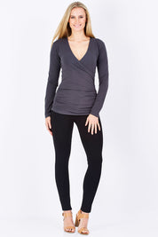 Model Maddy wearing size 10 of The Wrap Jersey Top in colour Charcoal (Grey), from the front, showing the whole outfit