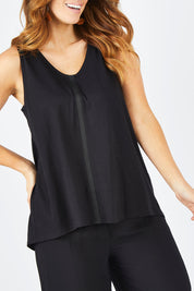 Model Laura wearing size 14 of The Cotton Bamboo Tank in colour Black (Black), from the front, cropped image