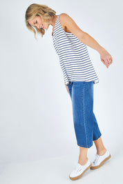 Model Chelsea wearing size 10 of The Cotton Bamboo Tank in colour Navystripe (Blue), from the front, showing the whole outfit