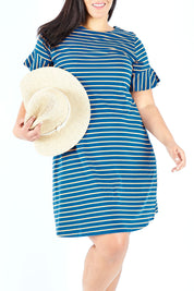 Model Lauren wearing size 18 of The Cotton Bamboo Frill Dress in colour Bluegold (Blue), from the front, cropped image