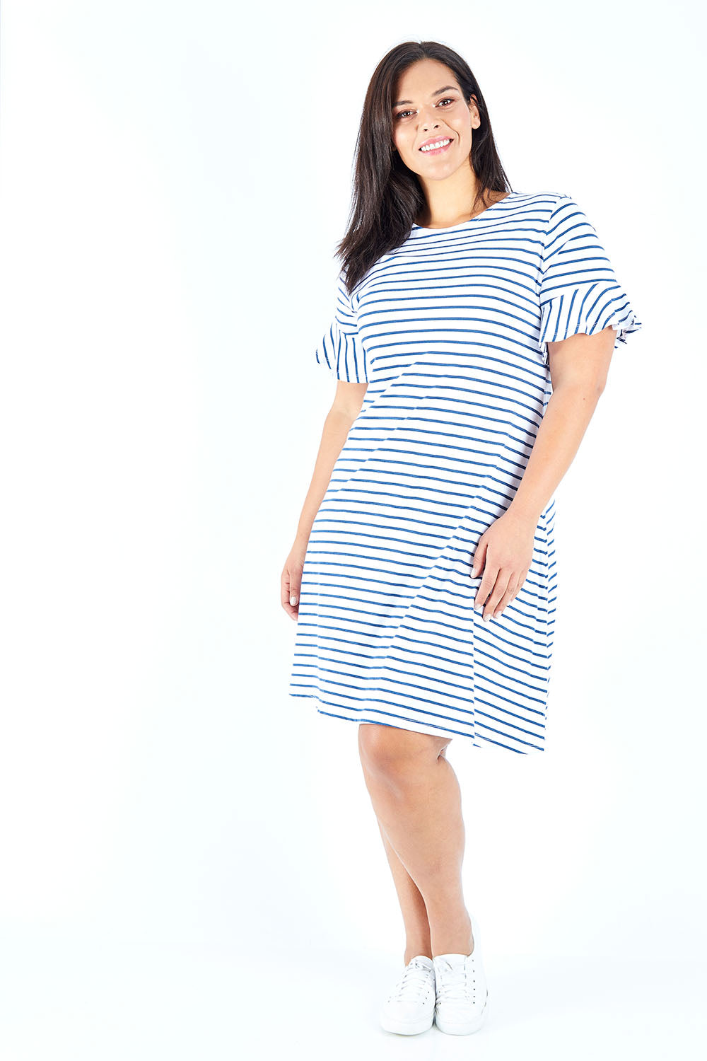 Model Lauren wearing size 18 of The Cotton Bamboo Frill Dress in colour Navystripe (Blue), from the front, showing the whole outfit