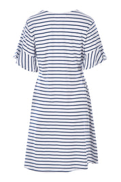 Product shot of The Cotton Bamboo Frill Dress in colour Navystripe (Blue), from the back