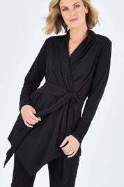 Model Chelsea wearing size 10 of The Ultimate Tie Cardi in colour Black (Black), from the front, cropped image