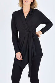 Model Chelsea wearing size 10 of The Ultimate Tie Cardi in colour Black (Black), from the front, cropped image