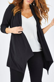 Model Laura wearing size 14 of The Ultimate Tie Cardi in colour Black (Black), from the front, cropped image