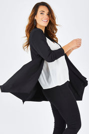 Model Laura wearing size 14 of The Ultimate Tie Cardi in colour Black (Black), from the front, cropped image