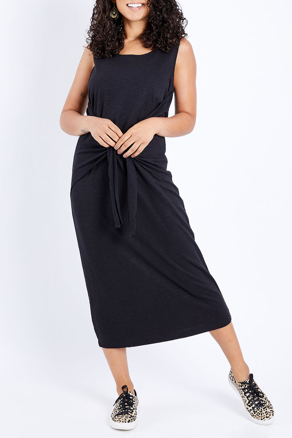 Model Pamela wearing size 10 of The Tie Waist Tank Dress in colour Black (Black), from the front, cropped image