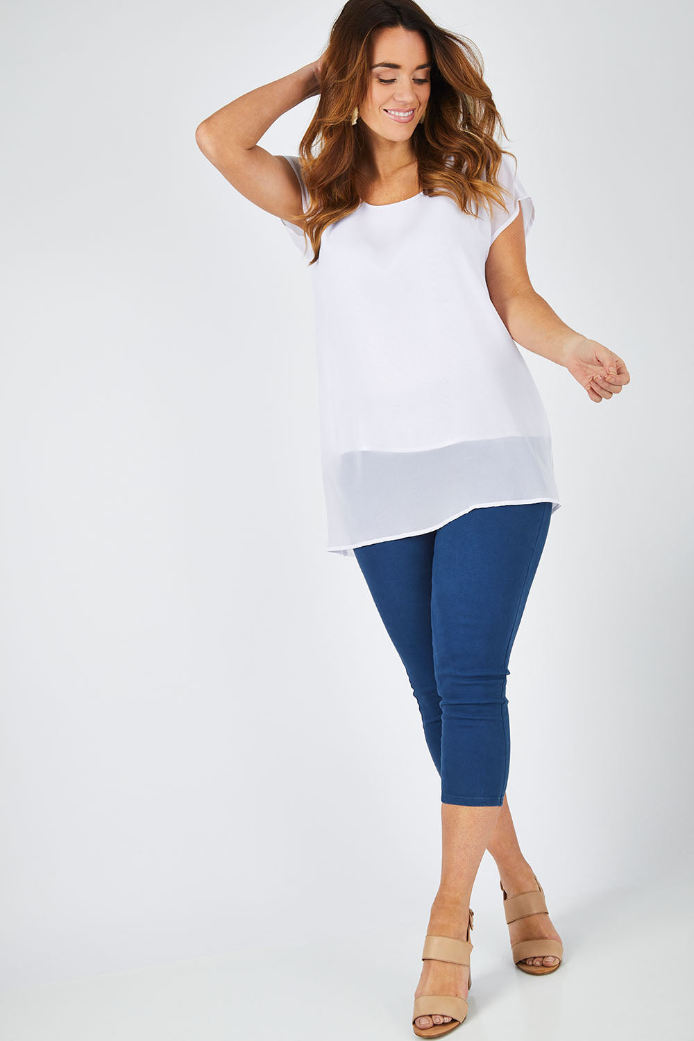 Model Laura wearing size 14 of The Chiffon Trim Top in colour White (White), from the front, showing the whole outfit