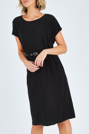 Model Chelsea wearing size 10 of The Belted Midi Dress in colour Black (Black), from the front, cropped image